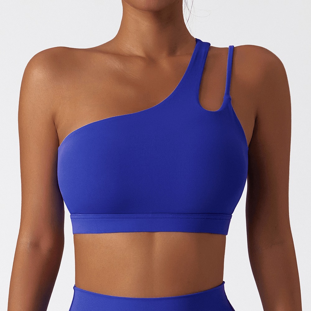 Vibrant blue one-shoulder sports bra for fitness featuring breathable nylon-spandex, ideal for active sports and style.
