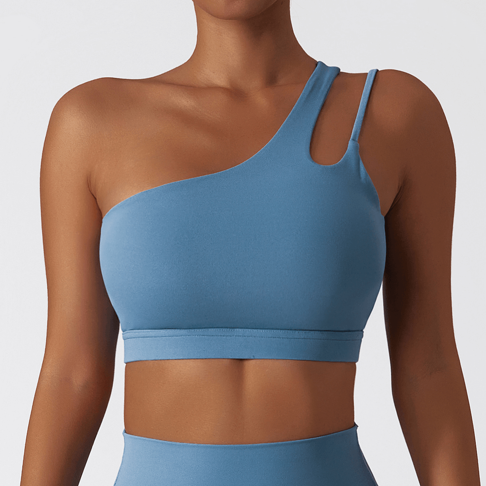 Sleek blue one-shoulder sports bra made of breathable nylon-spandex, perfect for active wear, running, cycling, and more.