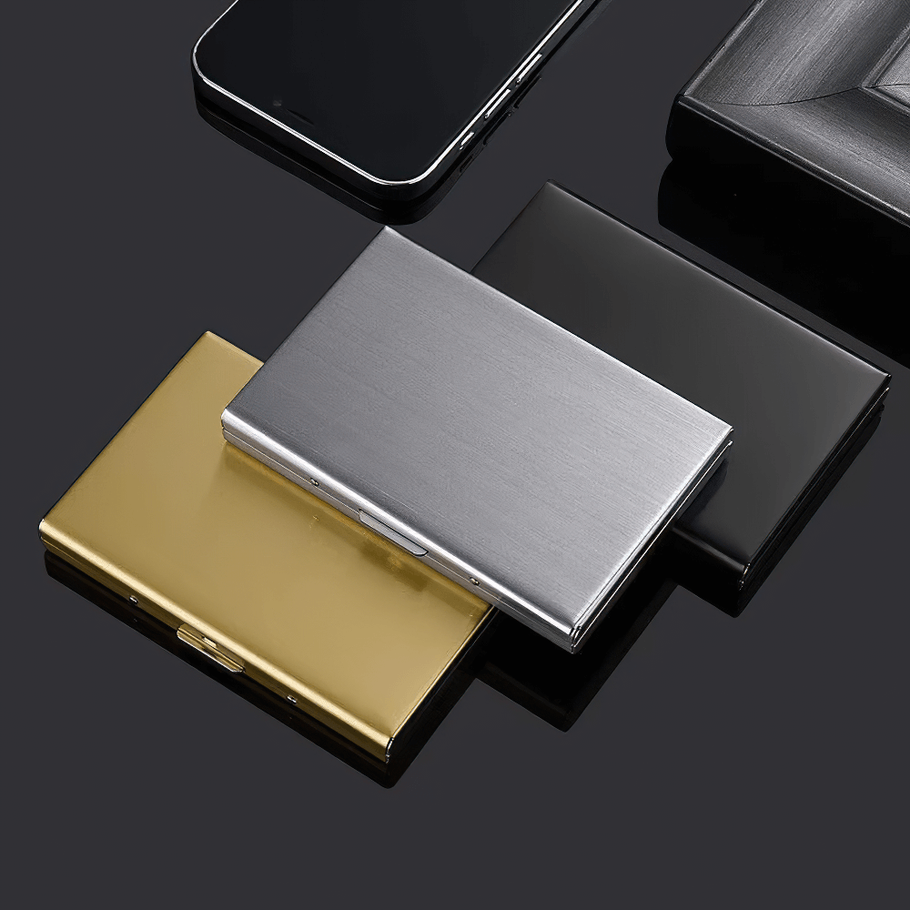 Sleek stainless steel card holder with secure buckle closure next to stylish accessories, showcasing minimalist elegance and functionality.