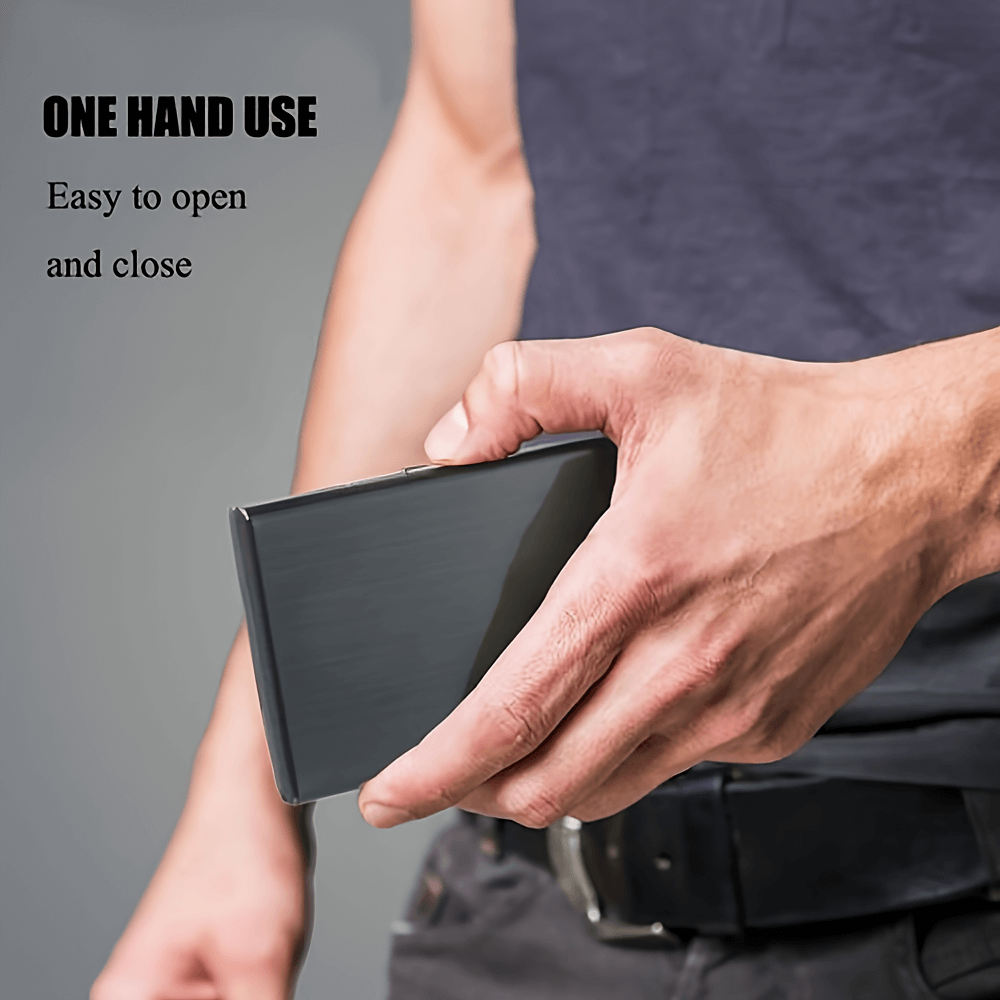 Man holding sleek stainless steel card holder with secure buckle, showcasing one-handed use feature.