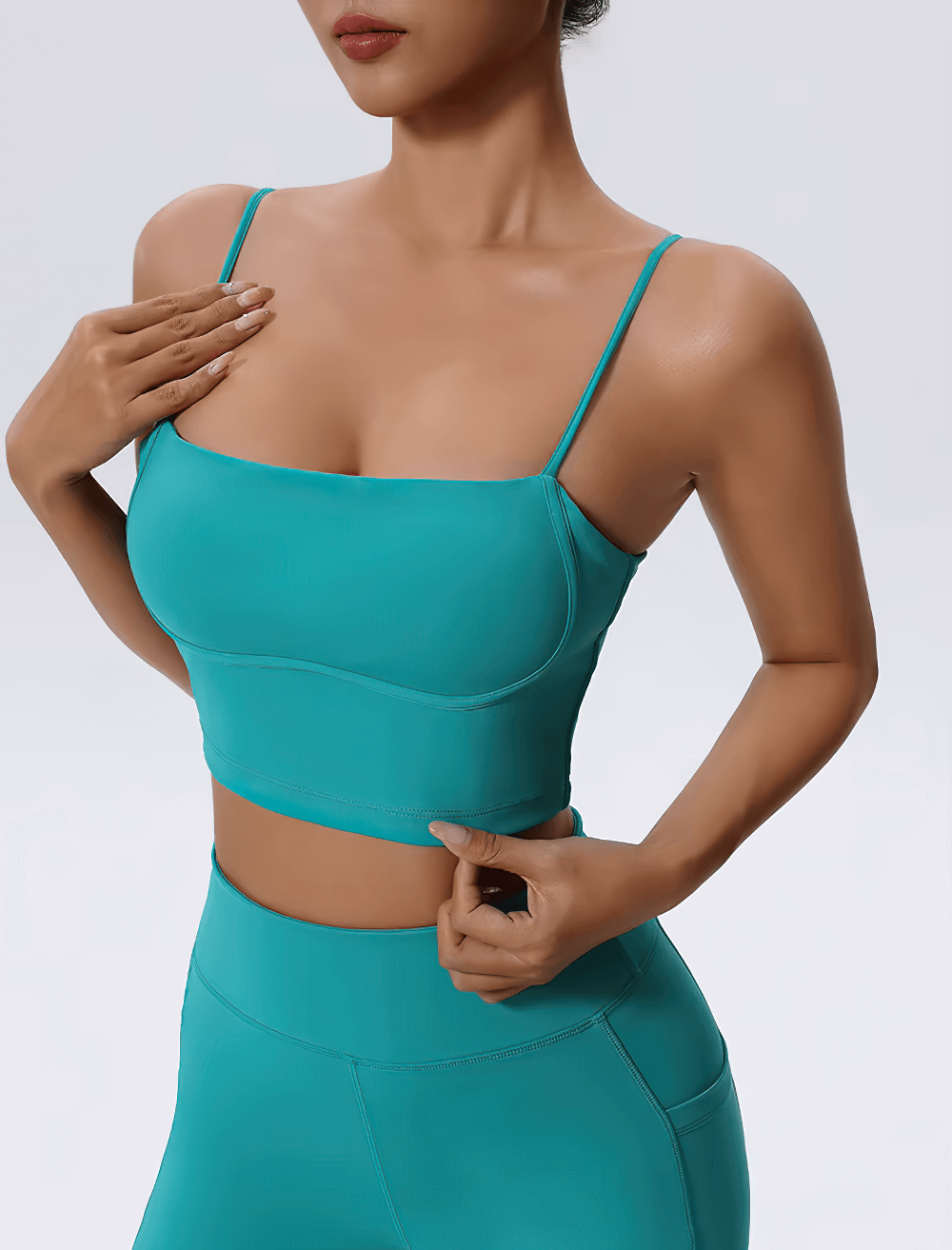 Vibrant blue women's fitness set with a sleeveless top and high-waist leggings, perfect for yoga, running, and hiking.