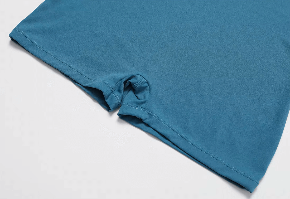 Close-up of blue athletic one-piece suit showing breathable and quick-drying material perfect for yoga or running fitness activities.