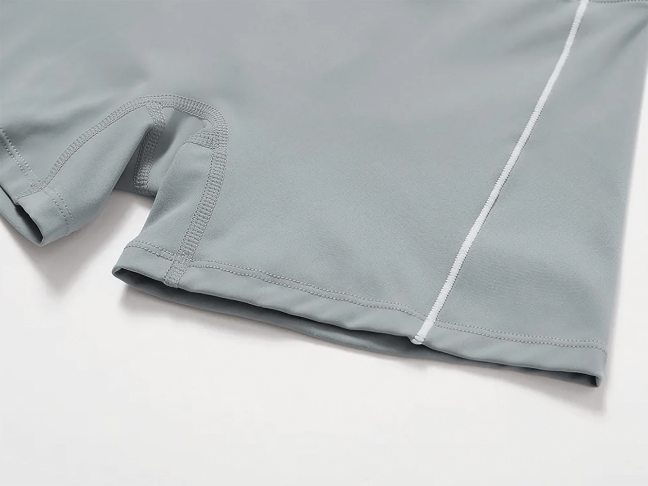 Close-up of sleek yoga flare pants in gray with durable nylon-spandex fabric, featuring quick-dry and anti-pilling technology.