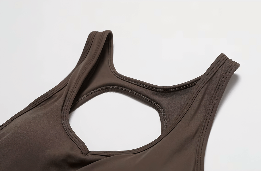 Close-up of a sleeveless backless yoga jumpsuit for women, showcasing breathable and durable fabric in a stylish design.