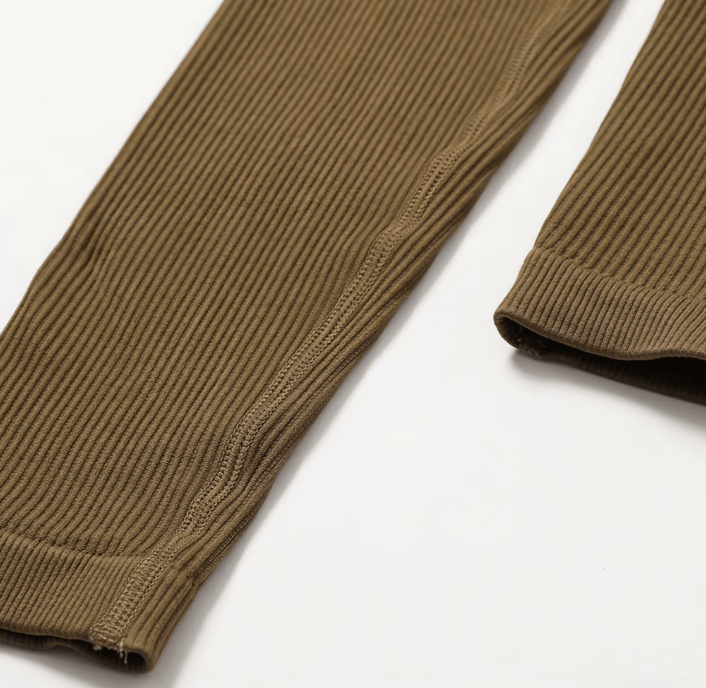 Close-up of olive green ribbed fabric detail of a seamless one-piece yoga suit, showcasing stretch and texture. Ideal for activewear.