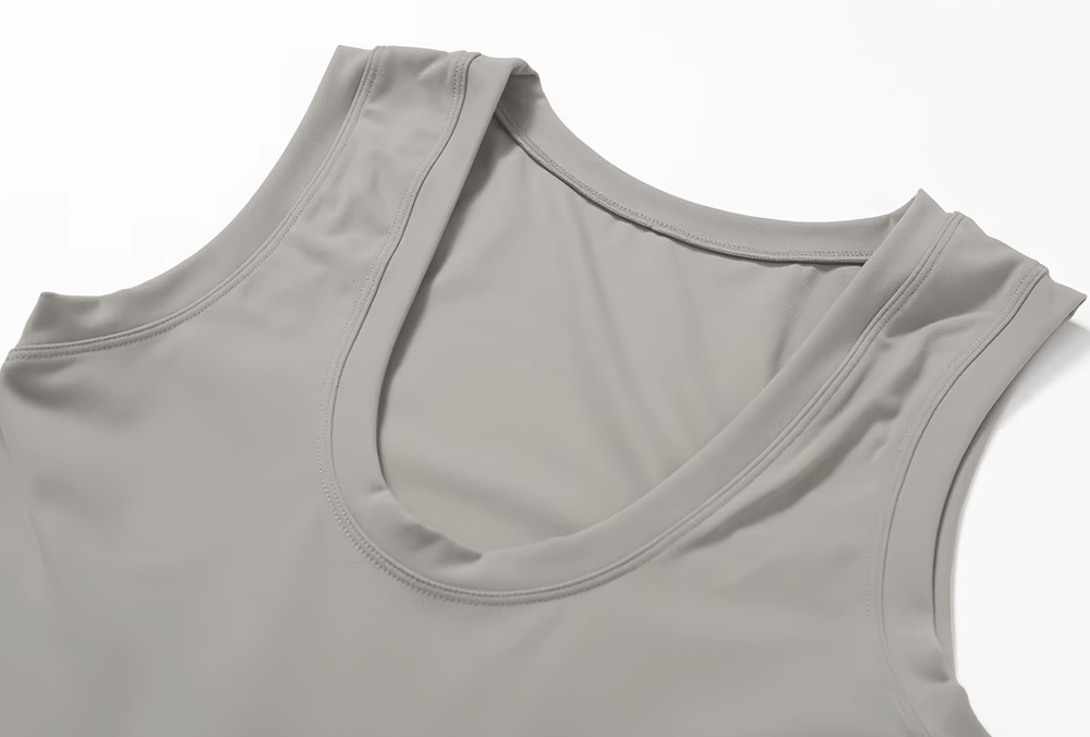 Close-up of sleeveless sports jumpsuit in gray showing fabric texture, ideal for summer workouts, fitness, and tennis.