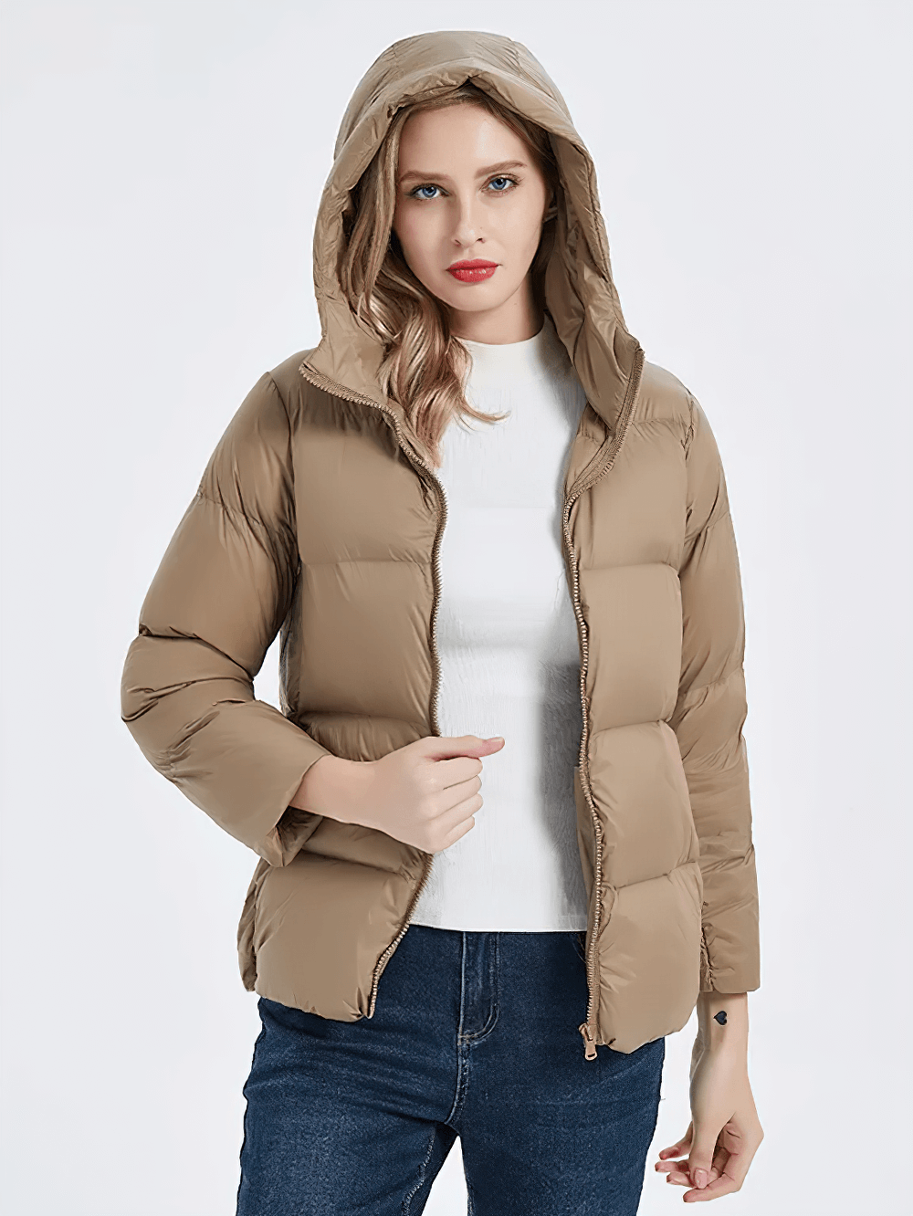 Woman wearing slim fit duck down jacket with hood in beige, SF2305, lightweight and warm with full sleeves and zipper closure.