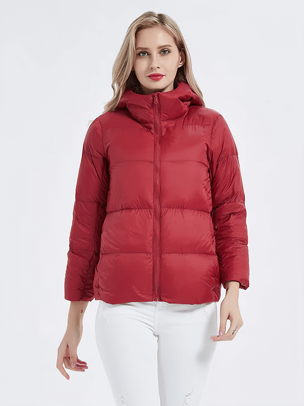 Red slim-fit duck down jacket with hood and pockets, lightweight polyester, full sleeves, perfect for chilly days.