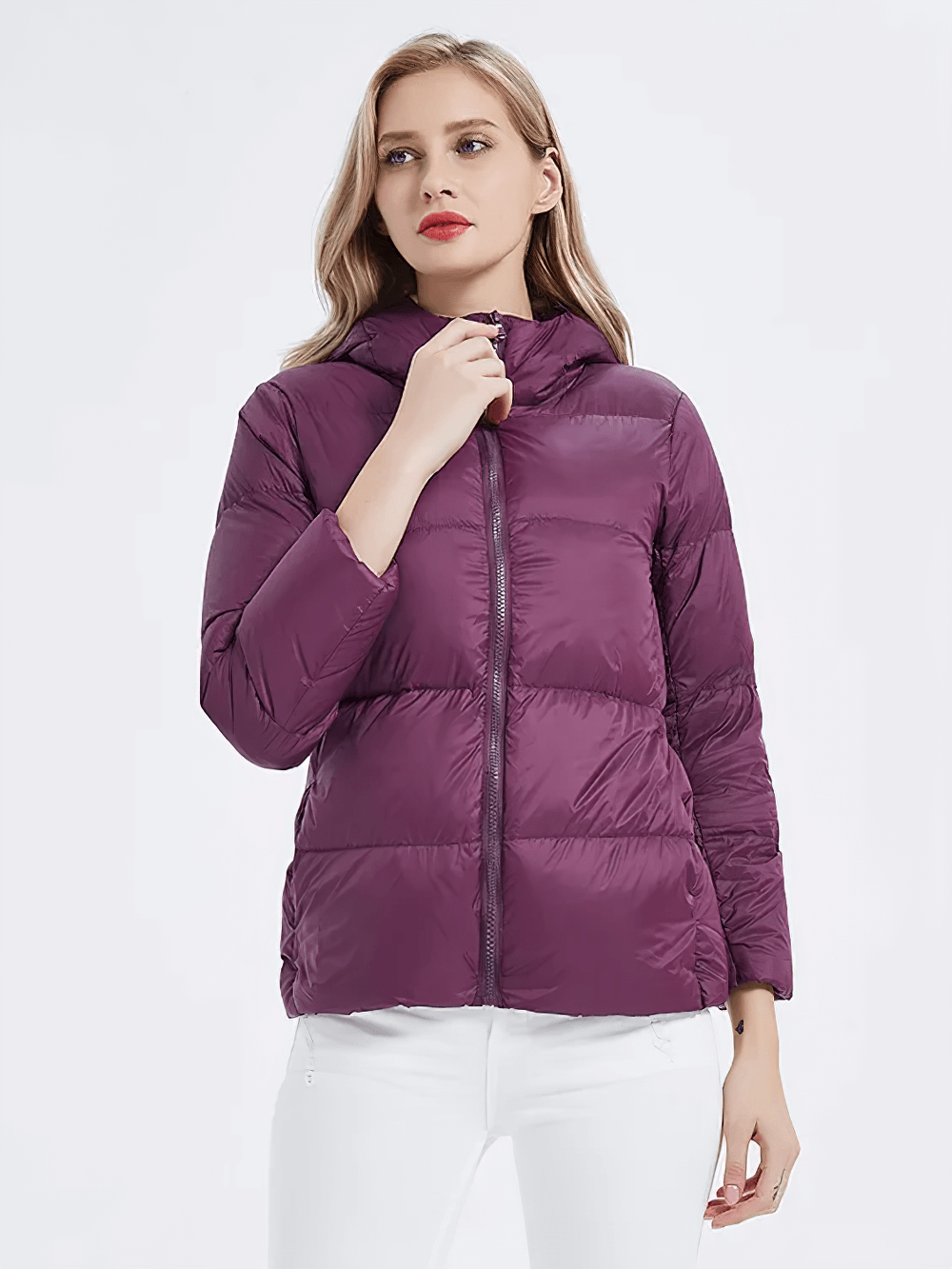 Woman wearing a plum slim-fit duck down jacket with pockets and hood, SF2305, featuring full sleeves and zipper closure for stylish warmth.