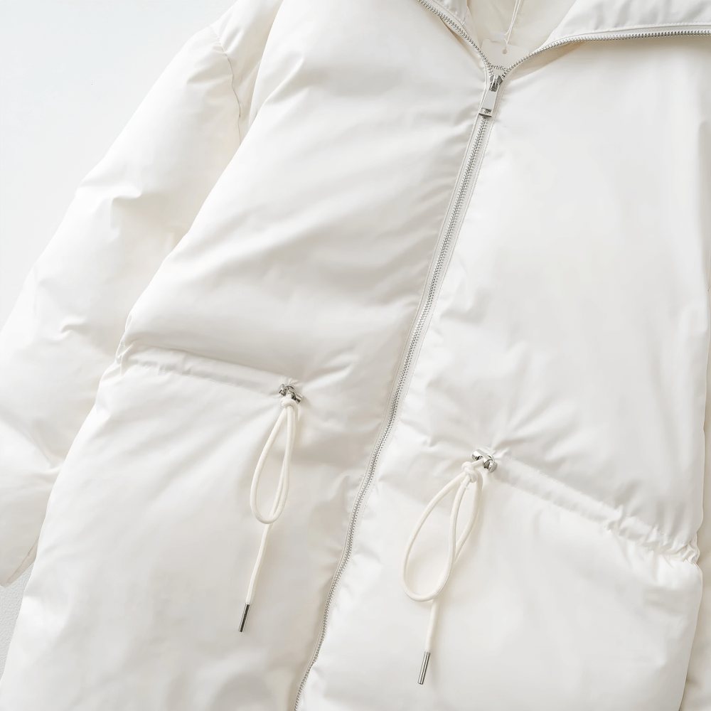 White slim-fit jacket with adjustable waist and belted closure, crafted from durable broadcloth fabric for winter styling.