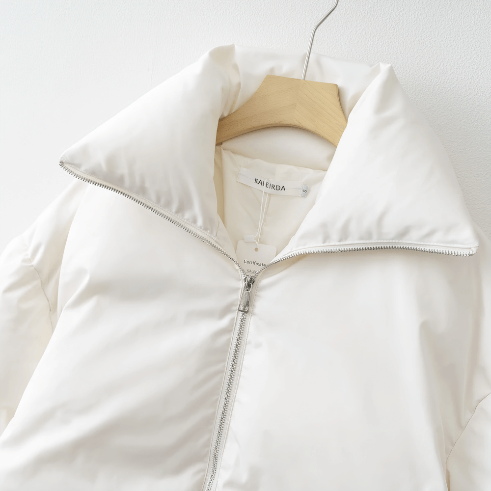 White slim-fit broadcloth jacket with adjustable waist and belted closure, perfect for winter layering and style.