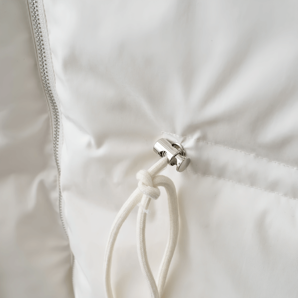 Close-up of adjustable waist on white slim-fit thick jacket SF2303, featuring belted closure and solid broadcloth pattern.