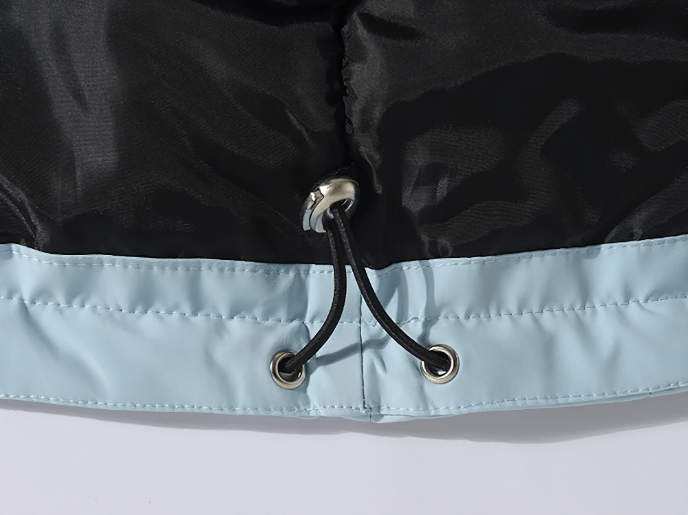 Close-up of drawstring detail on waterproof snowboard jacket, SF2555, showing windproof material and adjustable fit for winter sports.