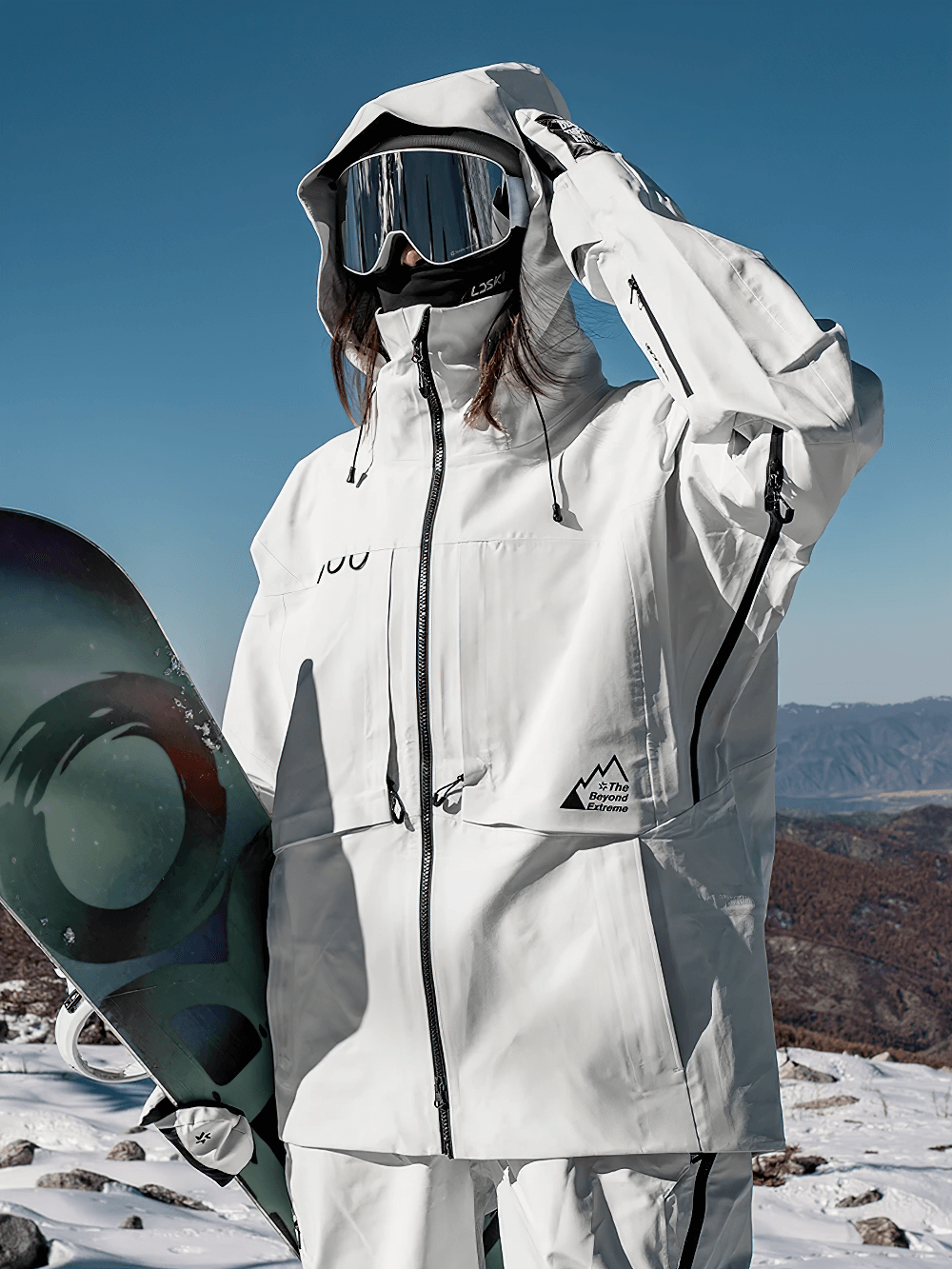 Snowboarding jacket with taped seams and hidden pockets, perfect for the slopes, windproof and waterproof design.