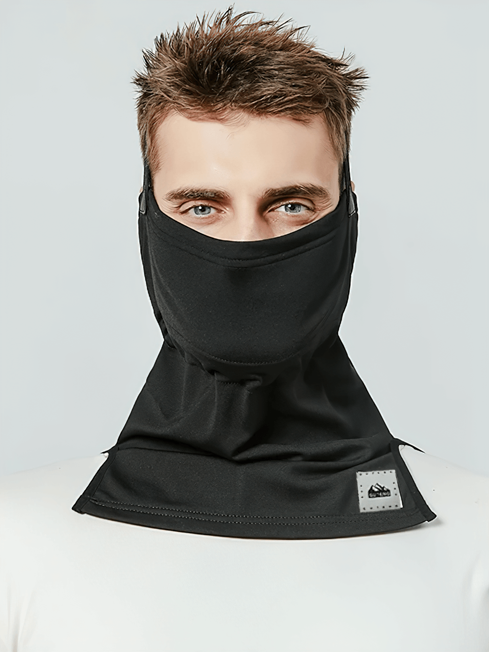 Man wearing Snowproof Thermal Face and Neck Guard, perfect for winter outdoor skiing and snowboarding protection, style SF2491.