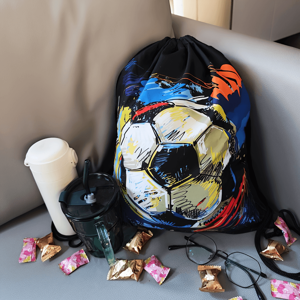 Stylish soccer print drawstring backpack with shoulder straps for sports, ideal for students and travelers, on a couch with snacks.