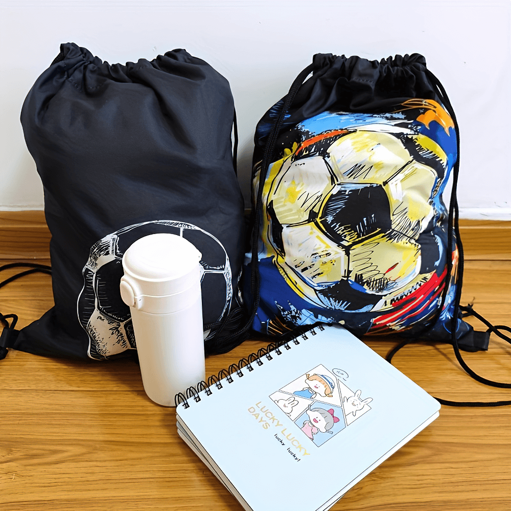 Soccer print drawstring backpacks with a white flask and notebook on a wooden floor.