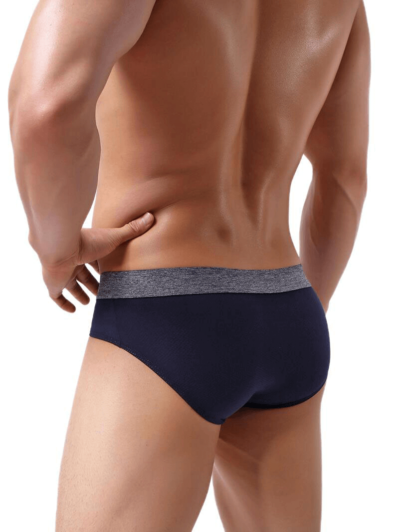 Soft nylon men's underwear, breathable elastic briefs in solid navy, offering a sleek low-rise fit for active men seeking comfort and support.