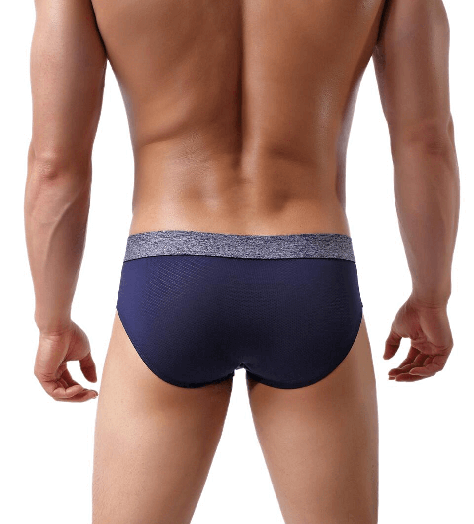 Back view of Soft Nylon Men's Underwear in navy blue with solid pattern and elastic waistband, offering comfort and breathability for an active lifestyle.