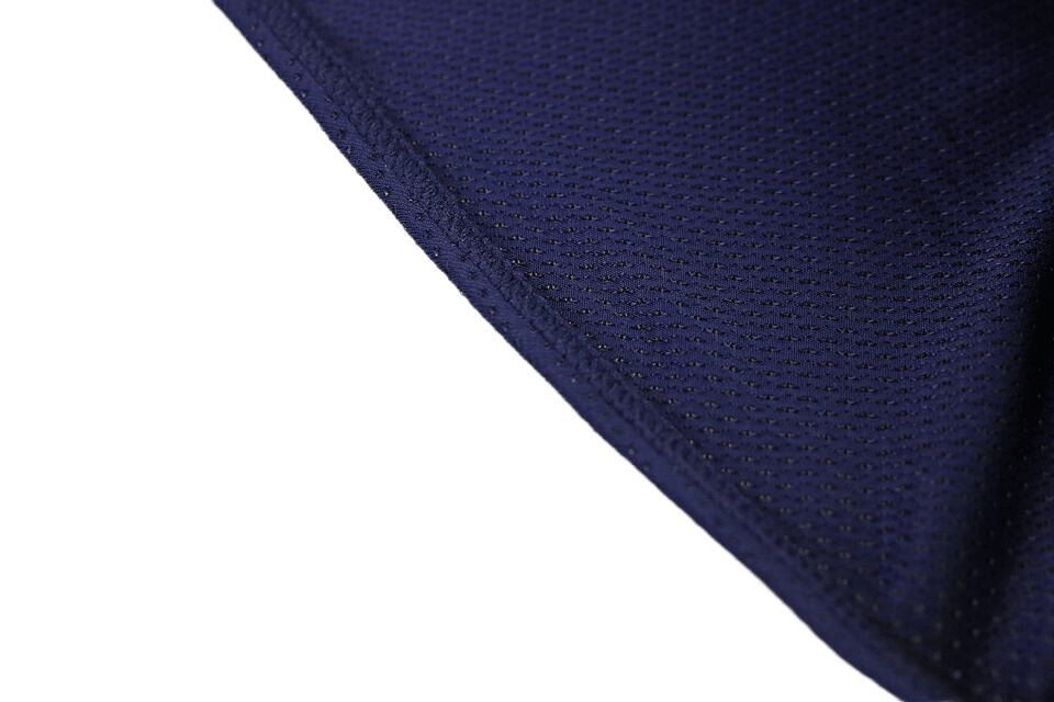 Close-up of soft nylon fabric in navy blue, showcasing breathable texture of men's underwear for an active lifestyle.