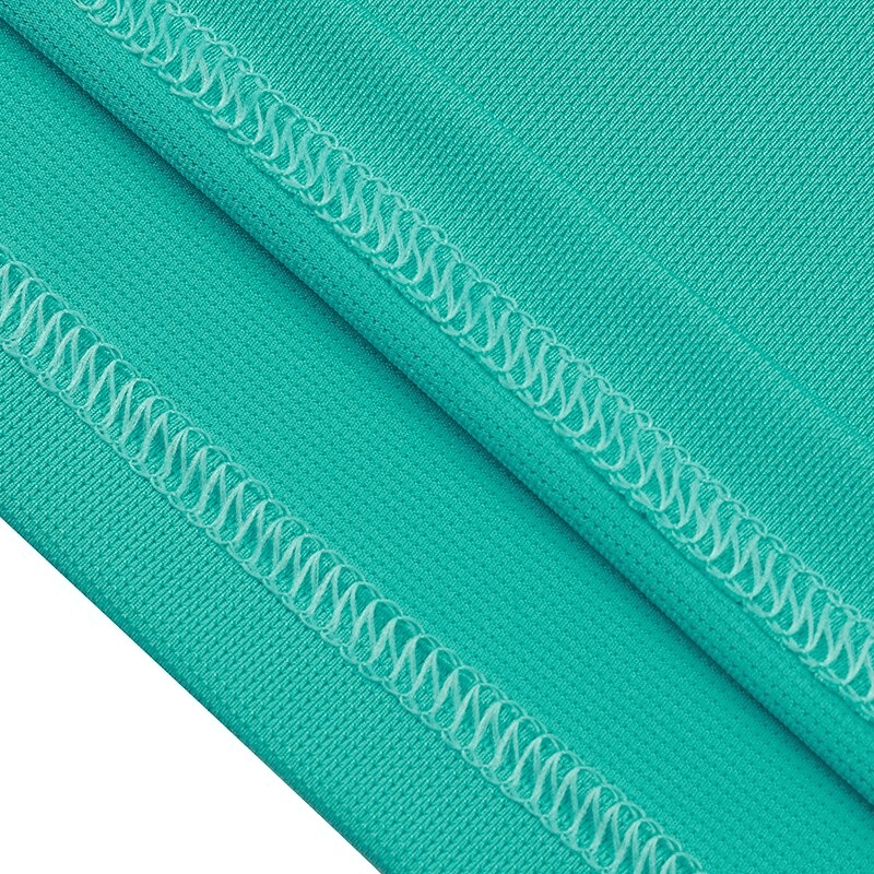Close-up of stitching on a turquoise solid color loose tank top, ideal for women's fitness, yoga, running, and cycling.