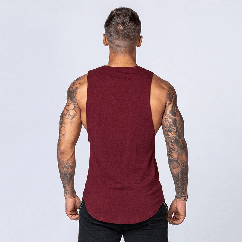 Man wearing a maroon solid cotton fitness tank top, showing back view, ideal workout wear for gym or boxing, model SF1491.