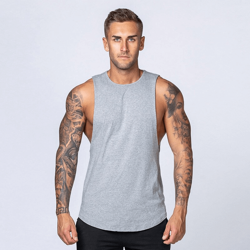 Gray solid cotton fitness tank top for men, ideal for gym workouts, showcasing durable lightweight fabric and a comfortable fit.