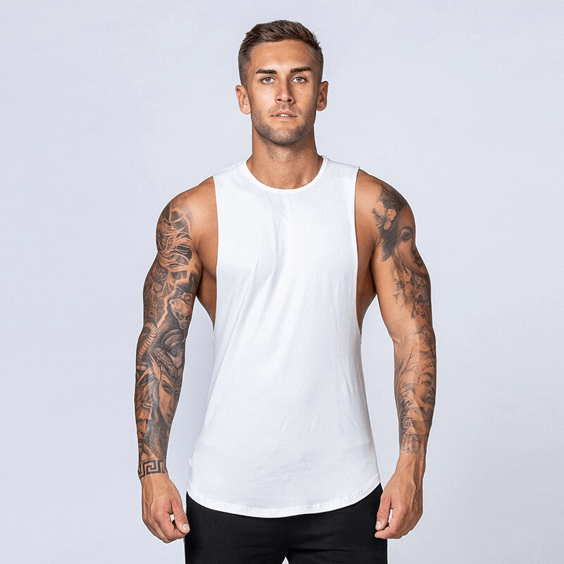 Man wearing a solid white cotton fitness tank top, showcasing comfort and style for workouts, SF1491 design.
