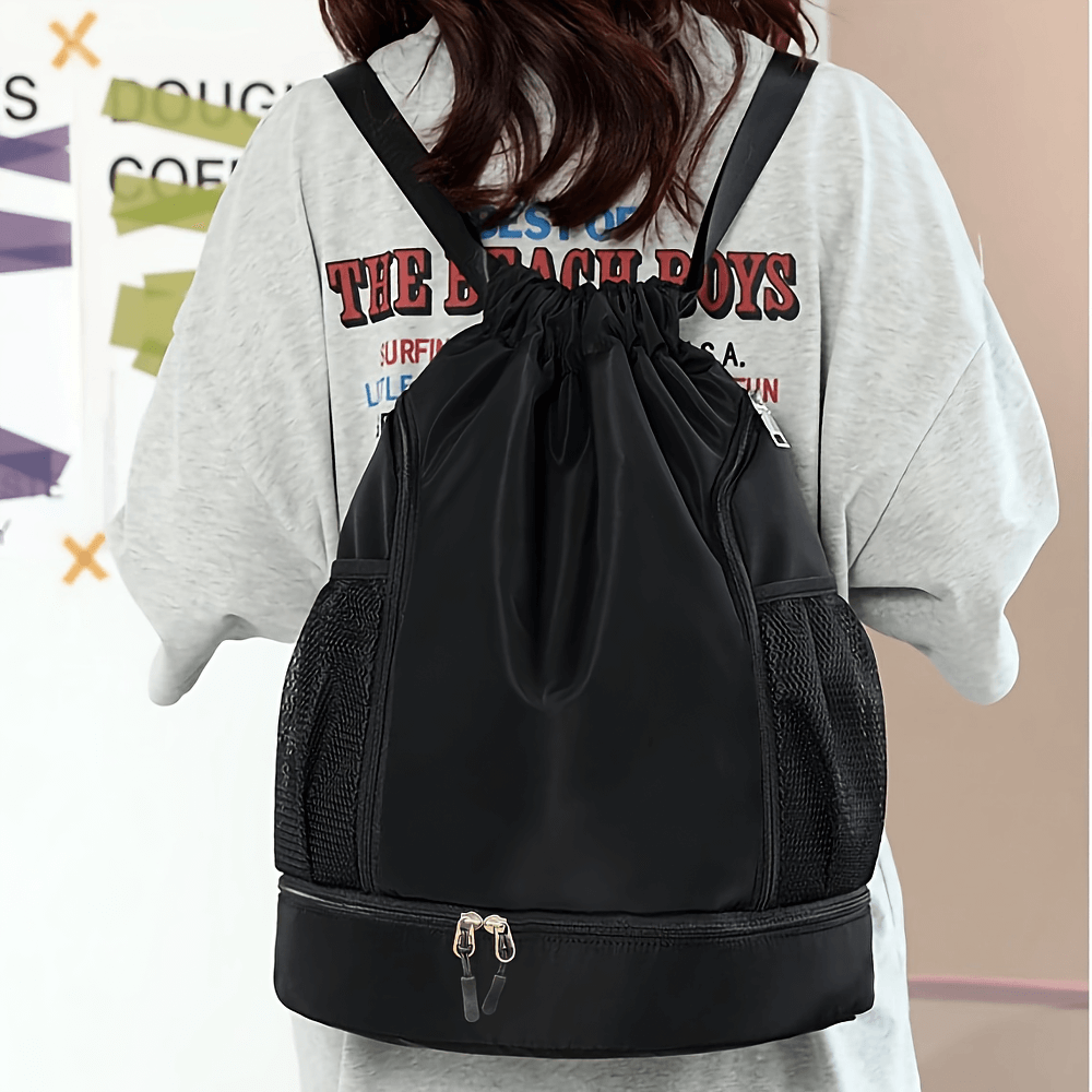 Stylish nylon backpack worn, featuring a drawstring closure and front zip pocket. Perfect for sports, travel, and outdoor adventures.