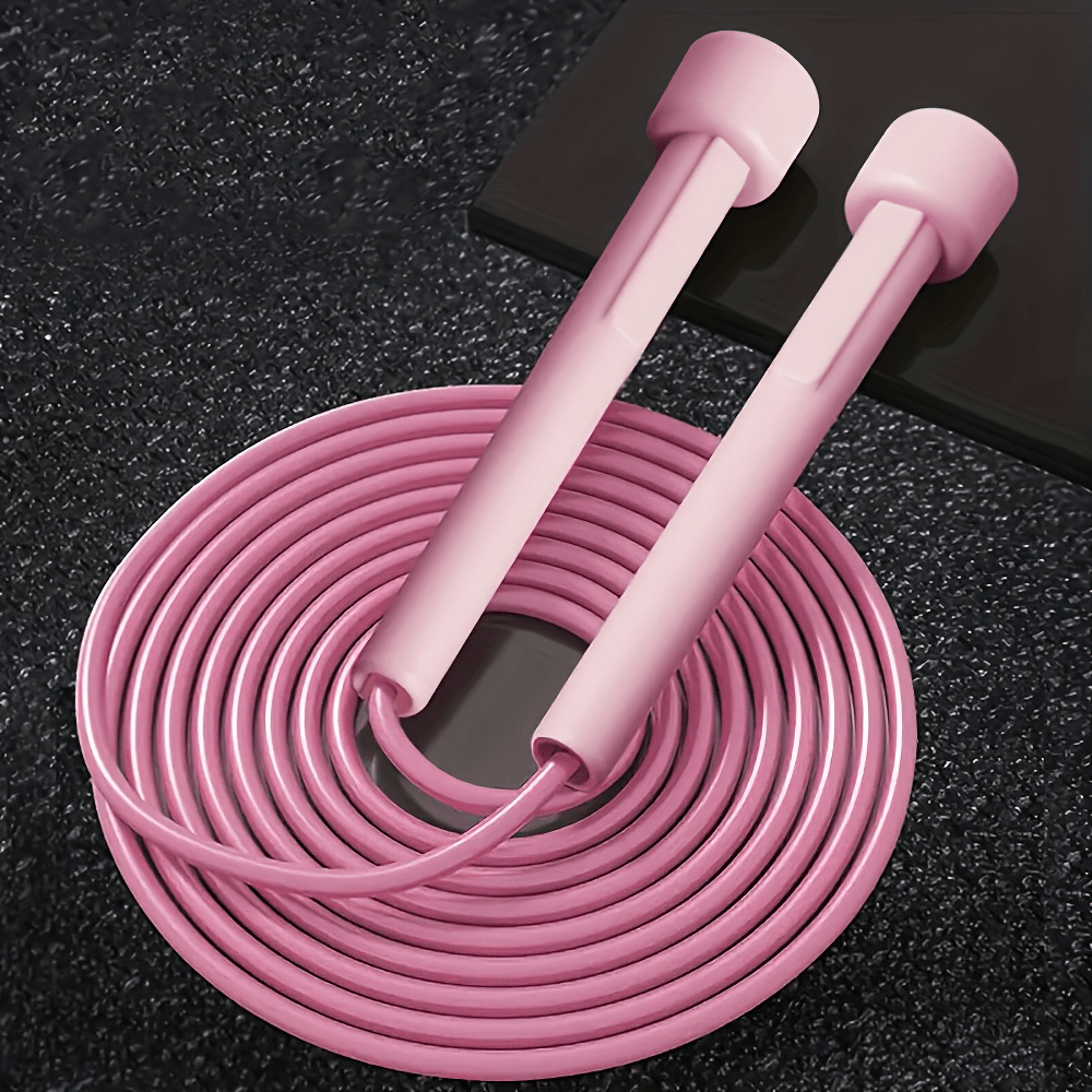 Pink speed jump rope with tangle-free design and non-slip silicone handles, perfect for cardio, endurance, and agility training.