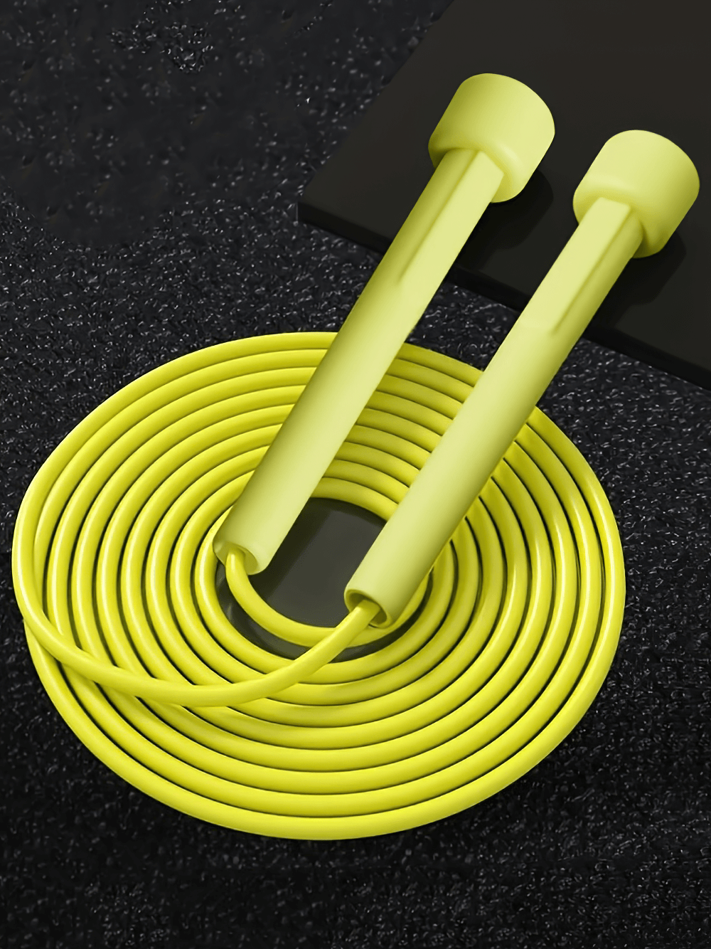 Yellow jump rope with non-slip silicone handles, ideal for speed and cardio training. Lightweight, tangle-free, perfect for workouts.