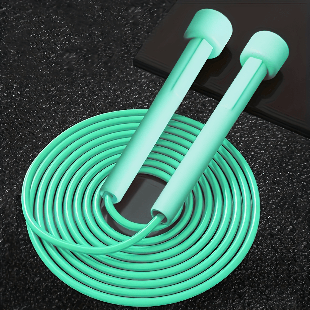 Green speed jump rope with non-slip silicone handles for cardio training, featuring a lightweight, tangle-free design.