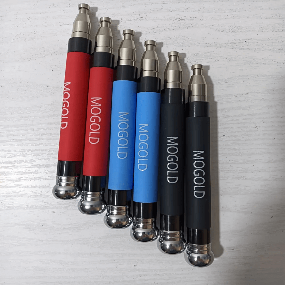 Colorful MOGOLD jump rope handles with non-slip silicone grips, ideal for cardio and HIIT, shown on a light wood surface.