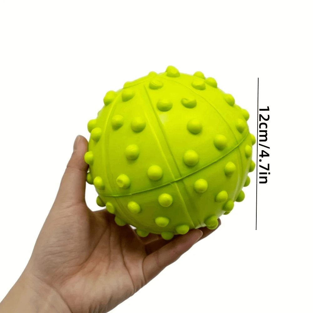 Hand holding a Spiky Fitness Massage Ball, SF3296, for muscle relief and improved circulation. Perfect for yoga and sports recovery.