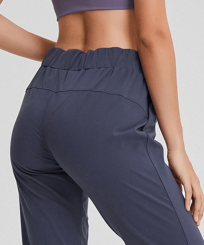 Back view of Sports Breathable Loose Women's Training Pants SF1420, showcasing high waist design and breathable fabric in navy blue.