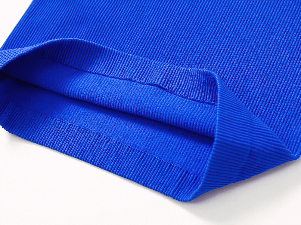 Close-up of ribbed blue fabric from a sports breathable racerback tank top, showcasing texture and durability for women's activewear.