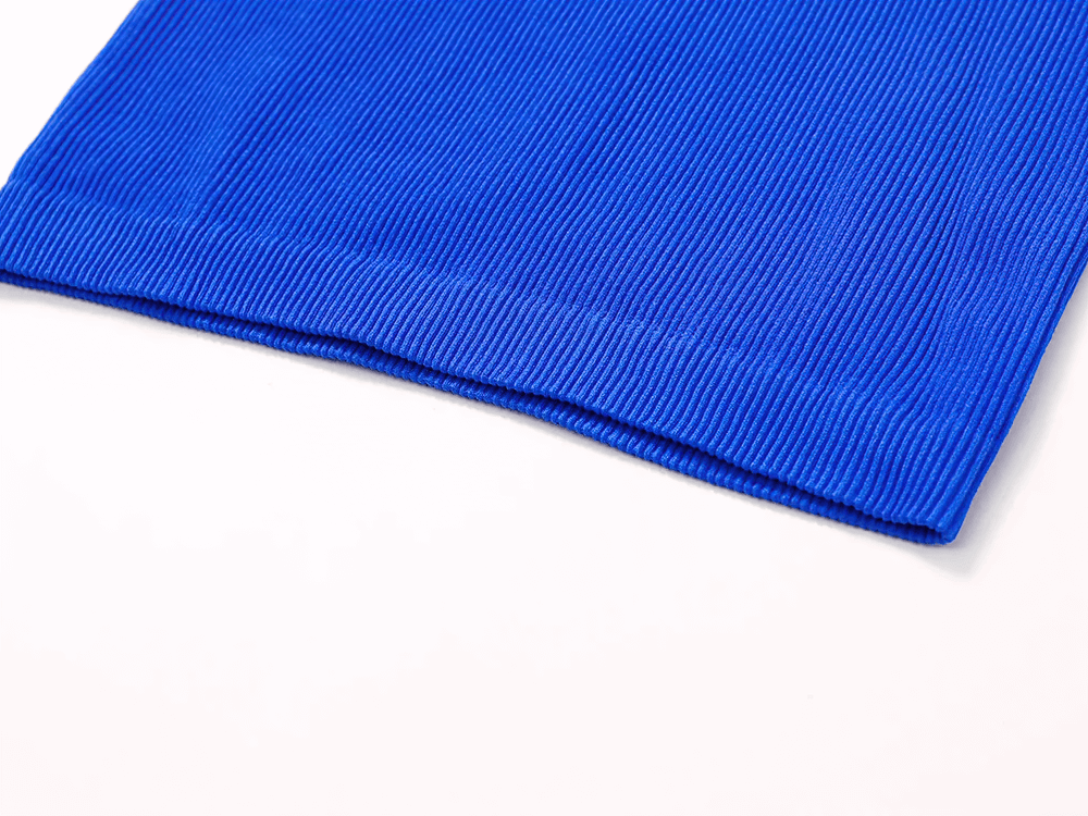 Blue ribbed sports tank top in close-up, showcasing breathable fabric and sleek design for women’s activewear or casual outfits.