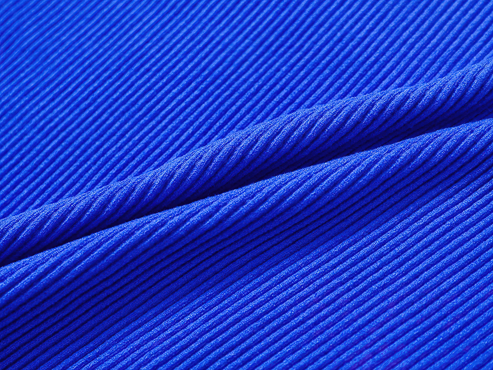 Close-up of vibrant blue ribbed fabric showcasing texture and pattern for breathable sportswear.