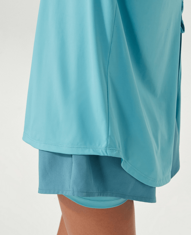 Close-up side view of blue sports breathable women's T-shirt with slit on back, highlighting quick-dry fabric and athletic design.