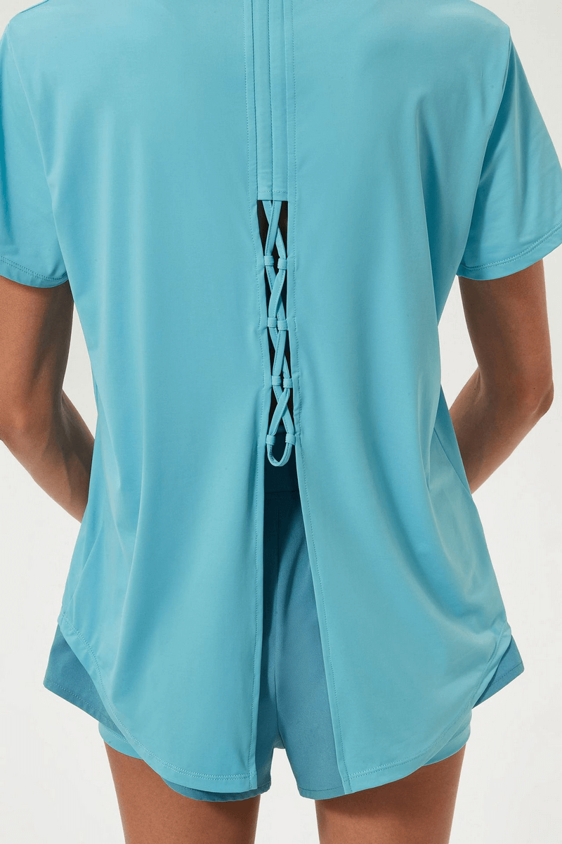 Sports breathable women's T-shirt in blue with stylish slit on back, perfect for staying cool during workouts. Ideal for yoga or gym.