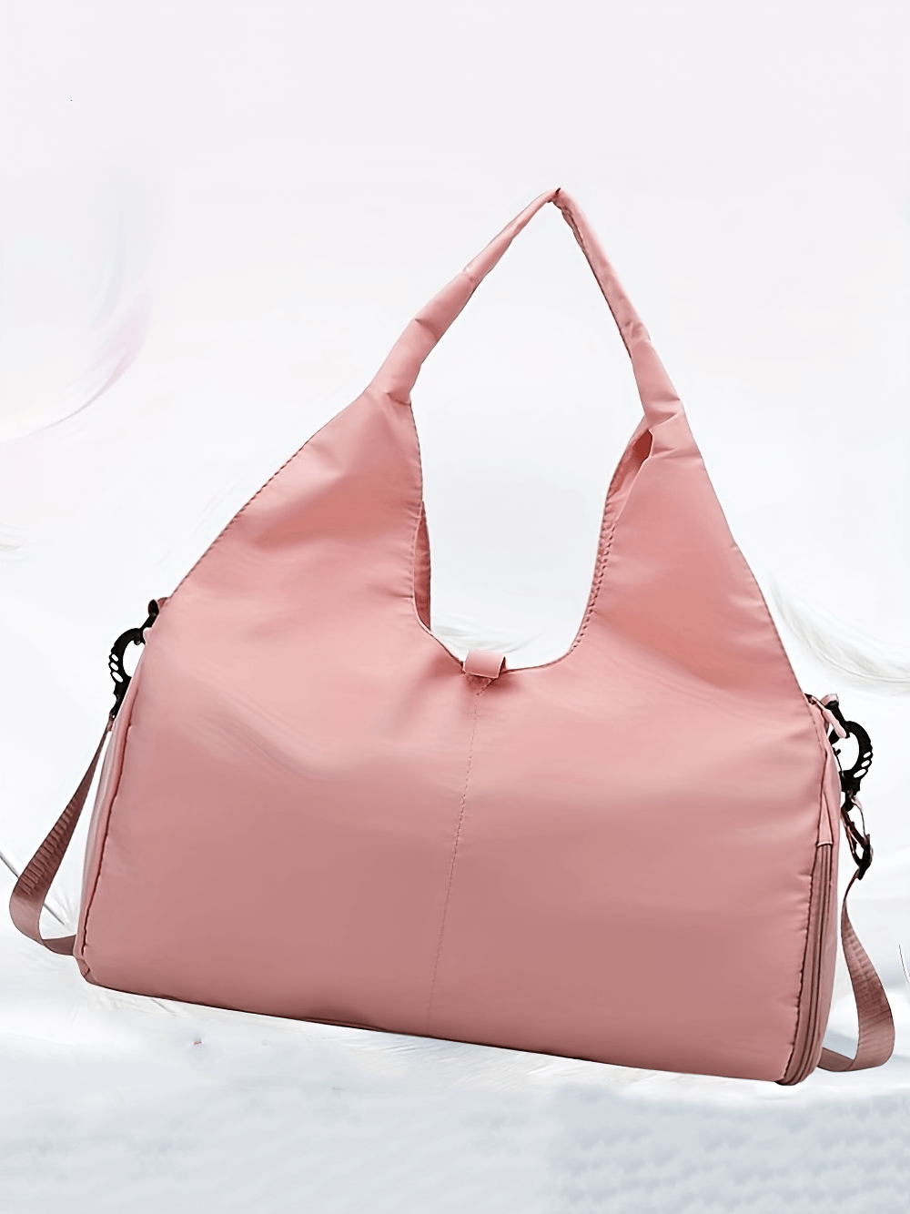 Stylish pink sports duffel bag with handle, ideal for gym and travel, featuring a spacious design and sleek look for versatile use.