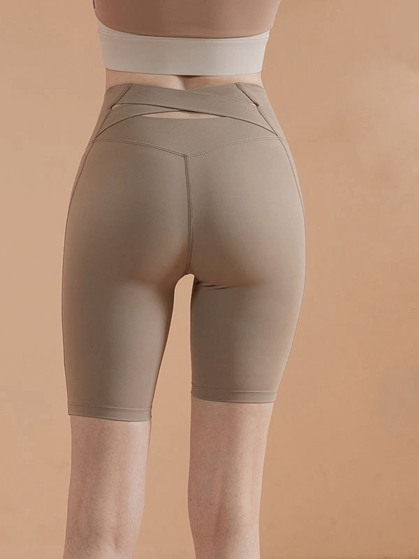 Back view of Sports Elastic Women's Fitness Shorts with High Waist in beige, showcasing breathable, stretchy fabric for yoga or running.