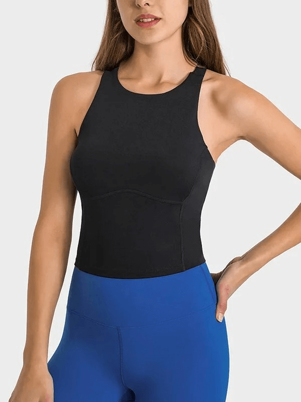 Woman wearing black sports elastic tank top with built-in bra from SF1810 collection, ideal for fitness and casual wear.