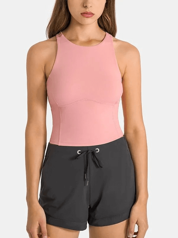 Sporty pink tank top with built-in bra, perfect for fitness and casual wear.