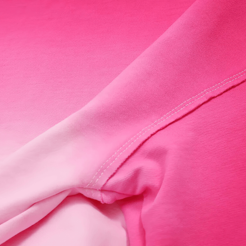 Close-up of pink gradient long sleeves crop top, showcasing breathable cotton fabric and stylish stitching details.