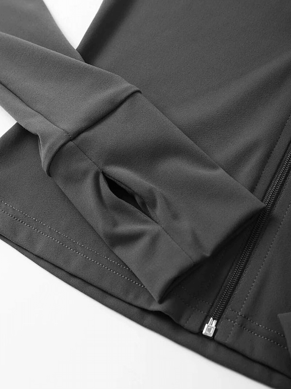 Close-up of a black full sleeve top with zipper from Women's Sports Fitness Set, featuring breathable nylon fabric for yoga and running.