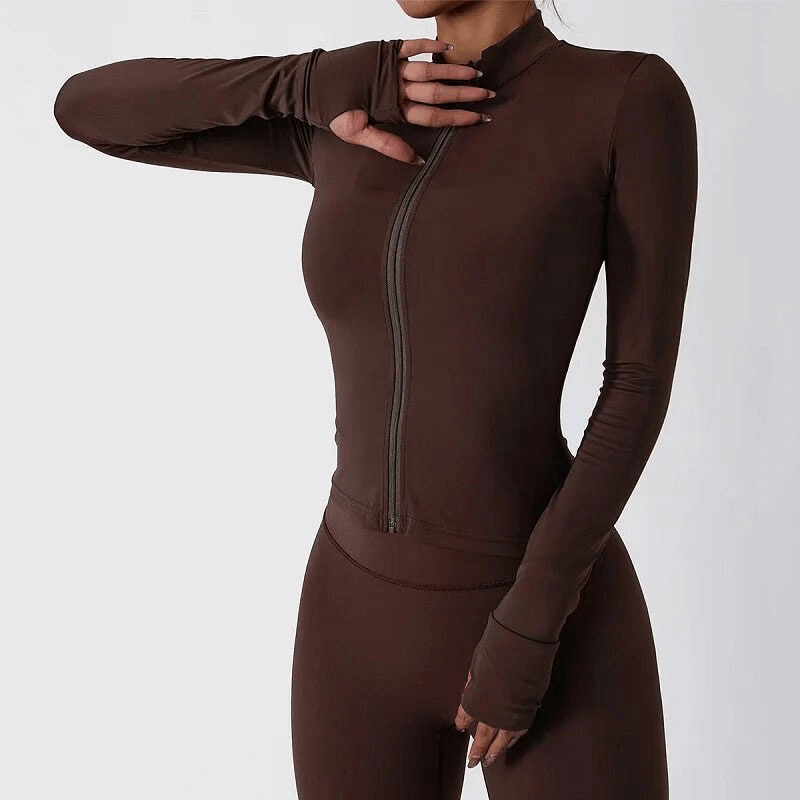 Woman wearing a brown full sleeve sports fitness set, featuring lightweight nylon fabric, ideal for yoga, running, and outdoor activities.
