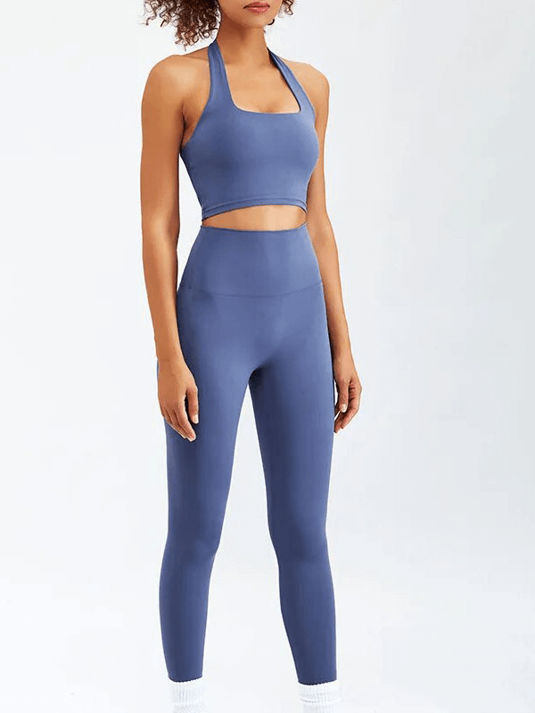 Woman wearing blue 2-piece sports fitness set for yoga and running with sleeveless bra and leggings, SF1766.