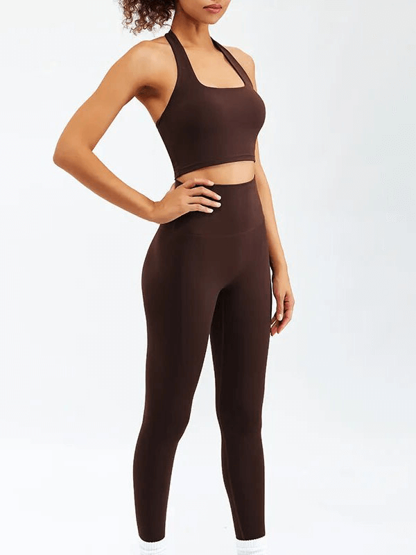 Woman wearing brown sports fitness set for yoga and running, featuring sleeveless bra and leggings, ideal for active lifestyle.