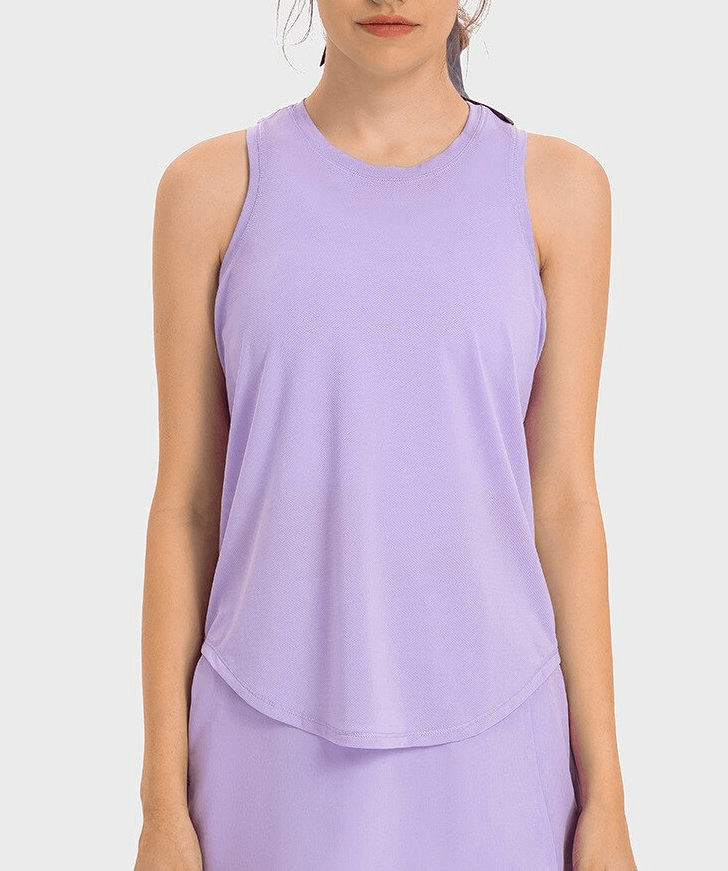Woman wearing a purple sports lightweight quick-drying tank top, perfect for yoga. Comfortable, breathable, made of spandex and nylon.